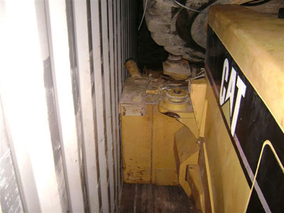Export Logistics & Shipping, Inc. loads Caterpillar 950 wheel loader onto cube container